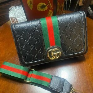 Black Crossbody Bag with Green and Red Strap